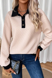 Diamond quilted polo sweatshirt in tan with black collar and button placket.