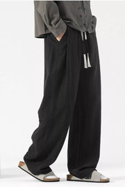 Black wide-leg lounge sweatpants with drawstring and pockets.