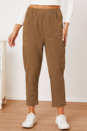 Camel corduroy barrel-leg utility pants with elastic waist and patch pockets.