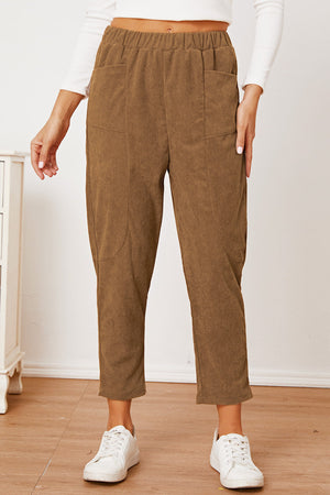 Camel corduroy barrel-leg utility pants with elastic waist and patch pockets.
