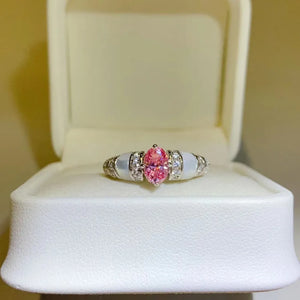 Pink oval moissanite and mother-of-pearl ring with diamond accents