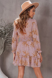 Light Mauve floral mini dress with smocked waist and ruffled hem.
