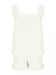 White polyester pajama set with ruffled straps and shorts.