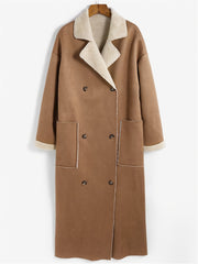 Brown reversible maxi coat with shearling trim, double-breasted closure, and patch pockets.