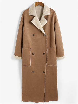 Brown reversible maxi coat with shearling trim, double-breasted closure, and patch pockets.