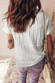 White textured V-neck maternity t-shirt with short sleeves and button details