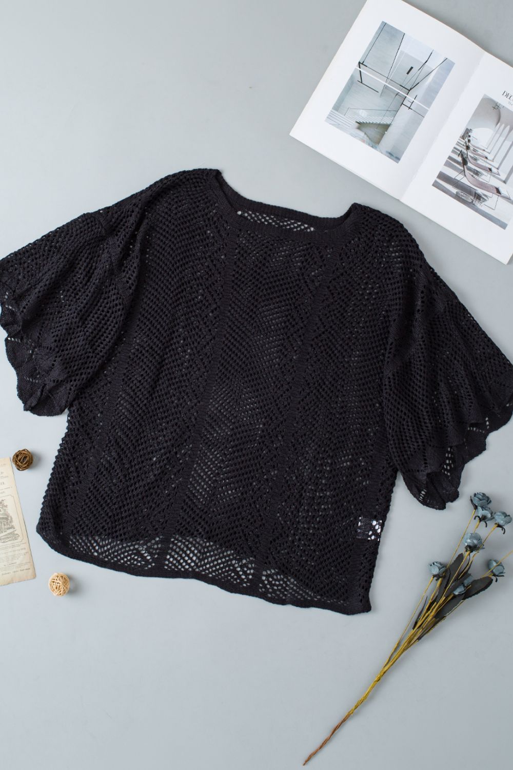 Black open-knit chevron sleeve top with a relaxed fit and wide sleeves.