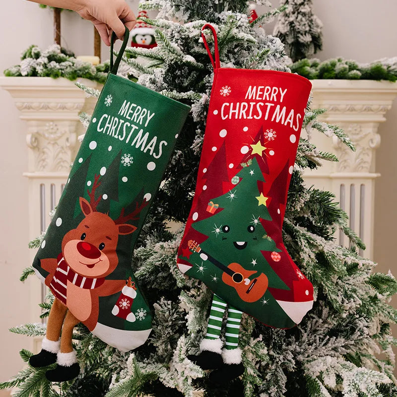 Animated Christmas stockings: green with reindeer, red with a tree playing guitar.