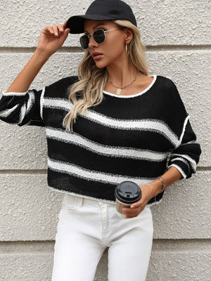 Black and white striped knit cropped sweater with a crew neck and long sleeves.