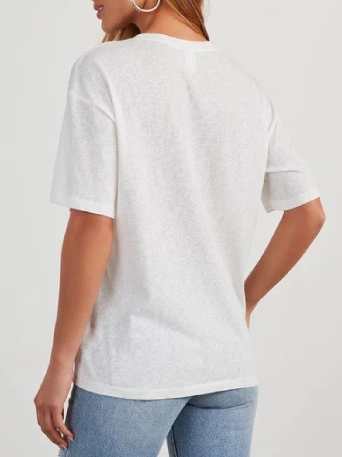 White linen boxy tee with short sleeves and a patch pocket, shown from the back.