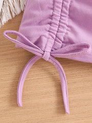 Violet toddler crop top with drawstring detail and bow.