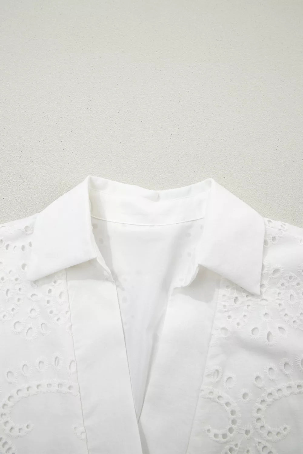 White cotton mini dress with eyelet embroidery detail and collar
