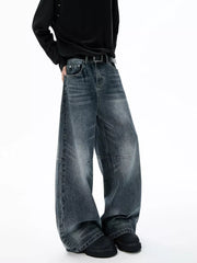 Belted dark-wash wide-leg jeans with unique paneled design and cotton fabric.