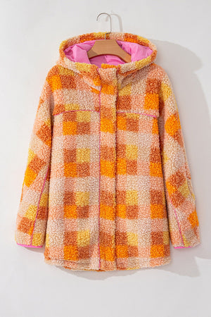 Checkerboard sherpa jacket in tangerine with contrast collar and pink hood lining.
