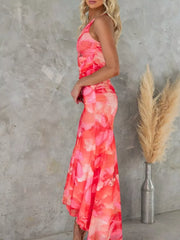 Red floral one-shoulder maxi dress with ruched sides and asymmetrical hem.