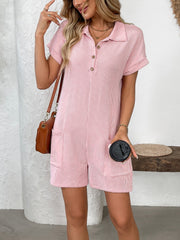 Blush pink ribbed knit romper with patch pockets, collared neckline, and button detail.
