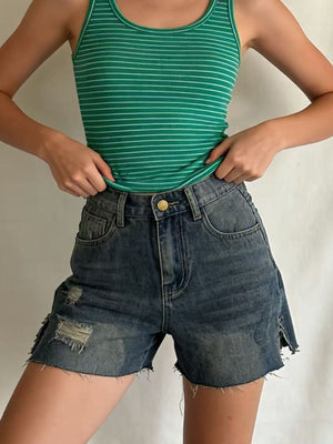 Denim shorts with frayed hem and distressed details, button closure, casual women's shorts.