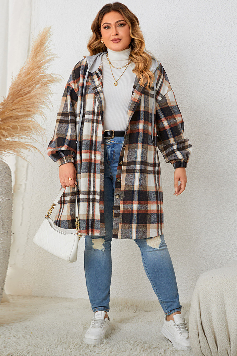 Plaid hooded shacket with balloon sleeves in black, featuring a button front and grey hood.