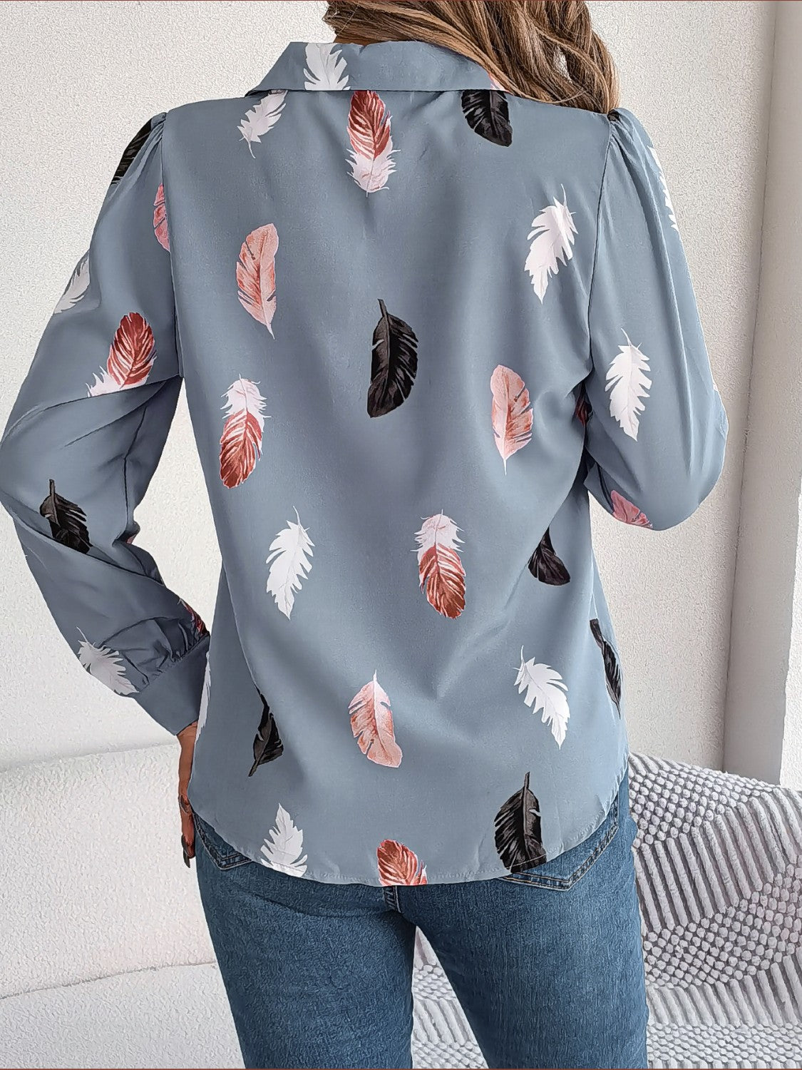 Misty Blue feather print blouson sleeve shirt with button-down collar.
