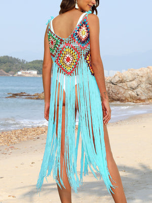 Crochet cover-up dress in aqua with colorful patchwork and long fringe detail.