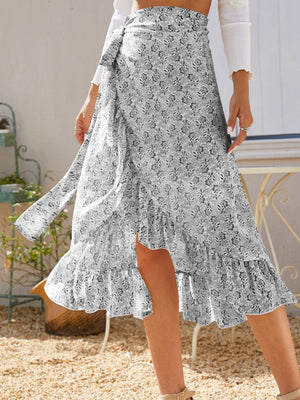 Asymmetric wrap skirt in Gray with a leaf print and ruffled hem.