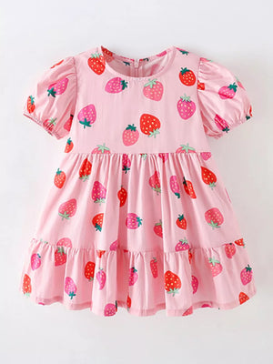 Pink tiered baby dress with puff sleeves and allover strawberry print, cotton blend.