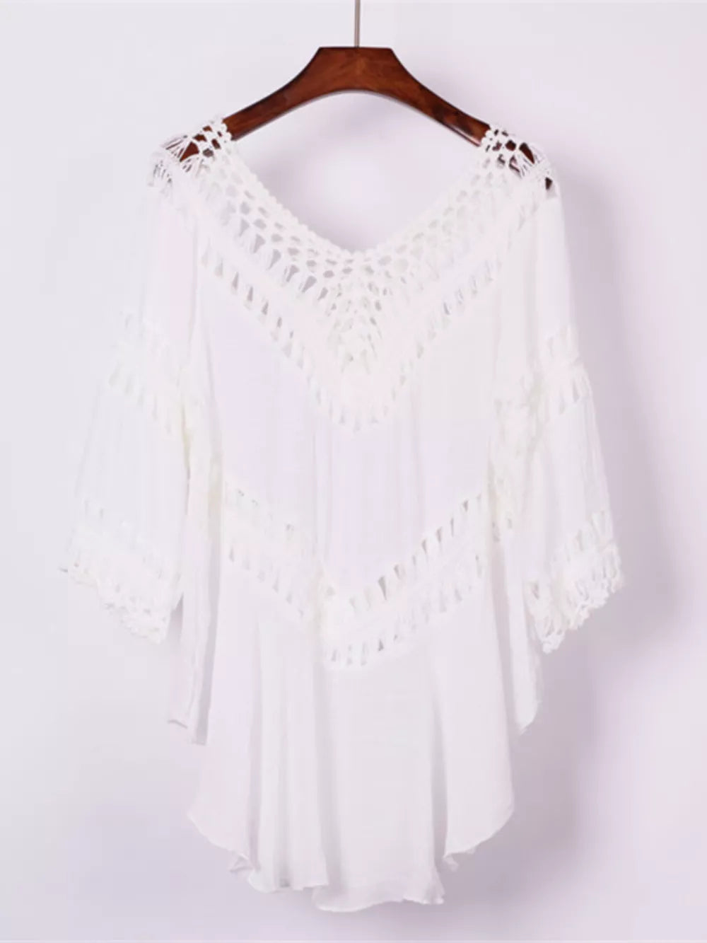White crochet-trimmed flowy cover-up with V-neck and cutout details.