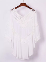 White crochet-trimmed flowy cover-up with V-neck and cutout details.