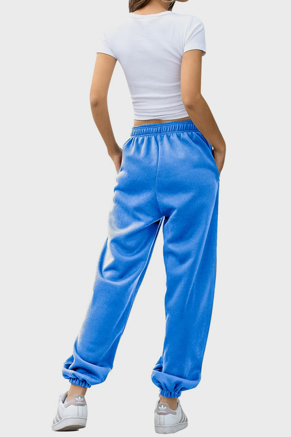 Blue slouchy sweatpants with gathered cuffs and pockets.