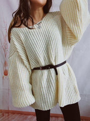 Oversized ribbed knit sweater in beige with a belted waist and off-the-shoulder neckline.
