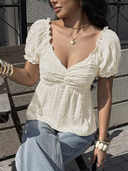 Cream textured puff sleeve maternity t-shirt with ruched front and sweetheart neckline