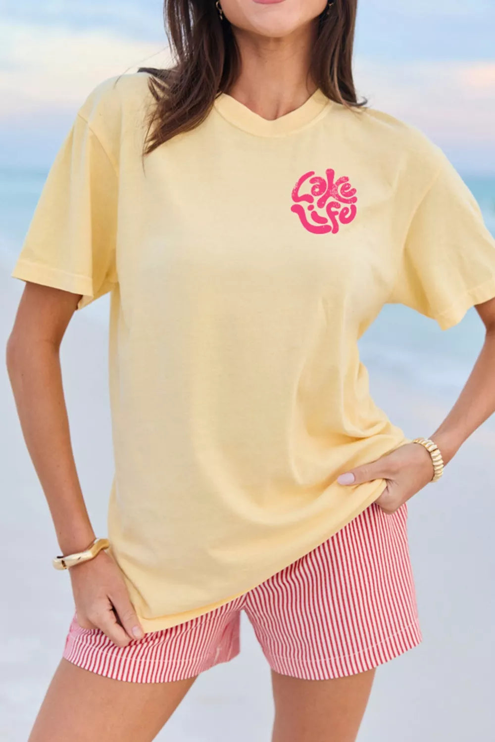 Yellow polyester t-shirt with distressed pink "Lake Life" graphic, crew neck, short sleeves.