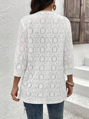 White floral lace duster with 3/4 sleeves and beaded neckline detail.