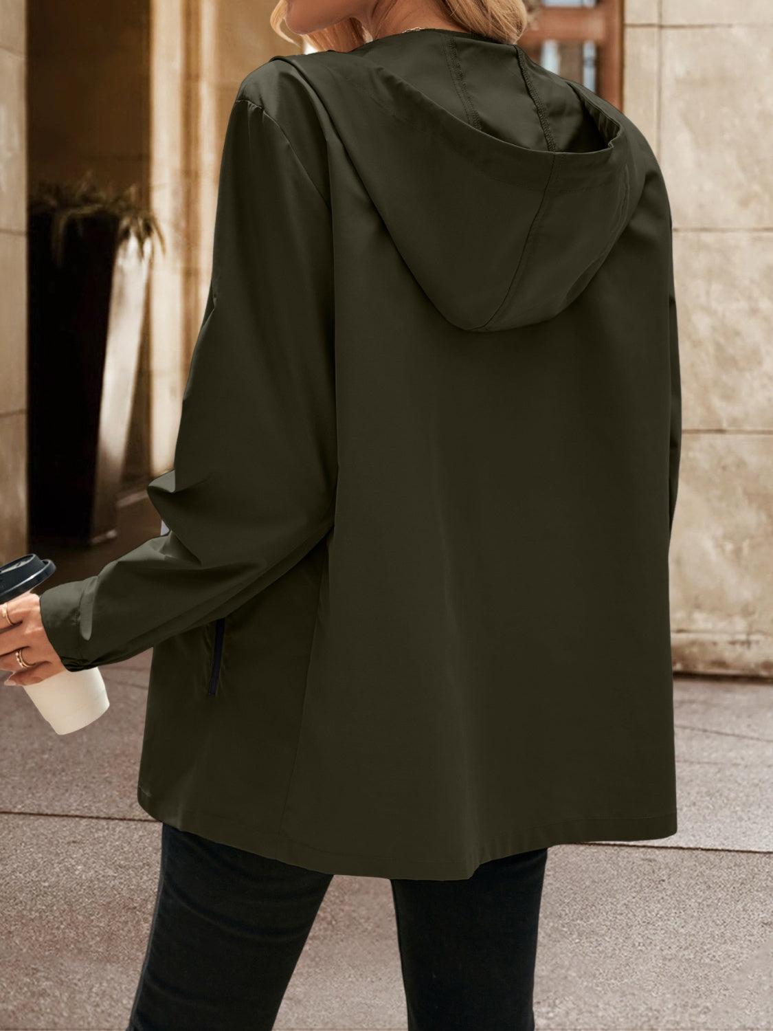 Army green hooded track jacket with zip detail and pockets.