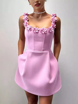 Pink floral embellished mini dress with pockets and square neckline.