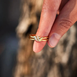 Gold knot ring with diamond accents, 18K gold-plated.