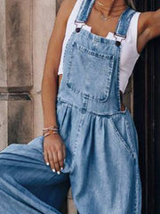 Light wash denim palazzo jumpsuit with bib pocket and wide legs