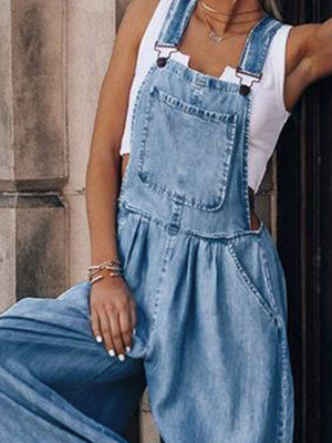 Light wash denim palazzo jumpsuit with bib pocket and wide legs