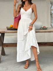 White lace tiered maxi dress with spaghetti straps and scalloped neckline.