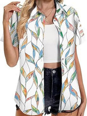 White short sleeve button-up shirt with colorful leaf print and collar.