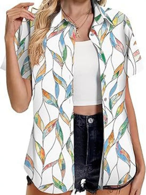 White short sleeve button-up shirt with colorful leaf print and collar.