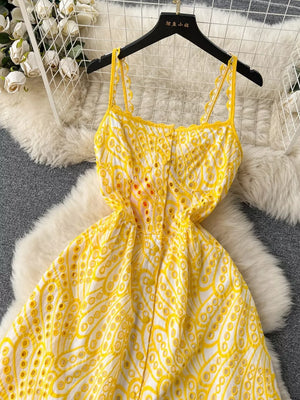Yellow lace-embroidered tiered cami dress with eyelet details and scalloped straps.