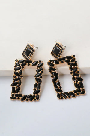 Black geometric jewel box earrings with gold alloy setting and faceted black stones.