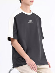 Men's contrast stitch t-shirt in dark gray with white raglan sleeves and chest logo.
