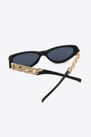 Black cat-eye sunglasses with gold chain detail on the temples.