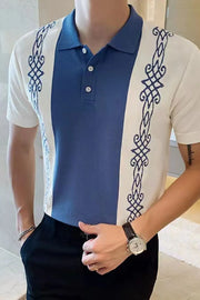 Embroidered panel polo shirt in dusty blue with white sleeves and blue front panel.