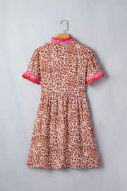 Leopard print dress with ruffled collar and cuffs