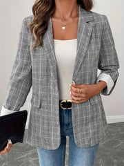 Light gray plaid blazer with buttoned front and cuffed sleeves, worn open over a white top.