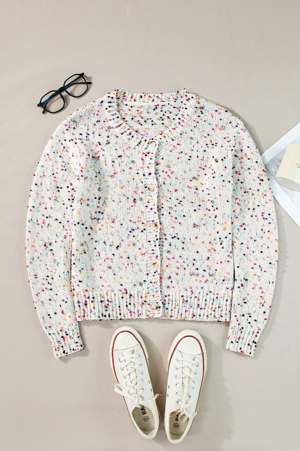 Confetti knit button-up cardigan in white with colorful speckles, crew neck, long sleeves.