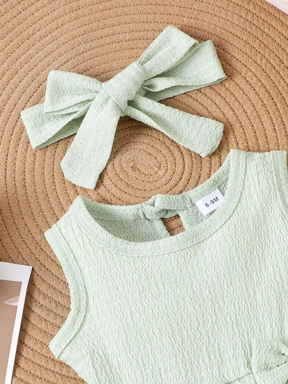 Children's Bow Tank And Shorts Set in Light Green, close-up detail